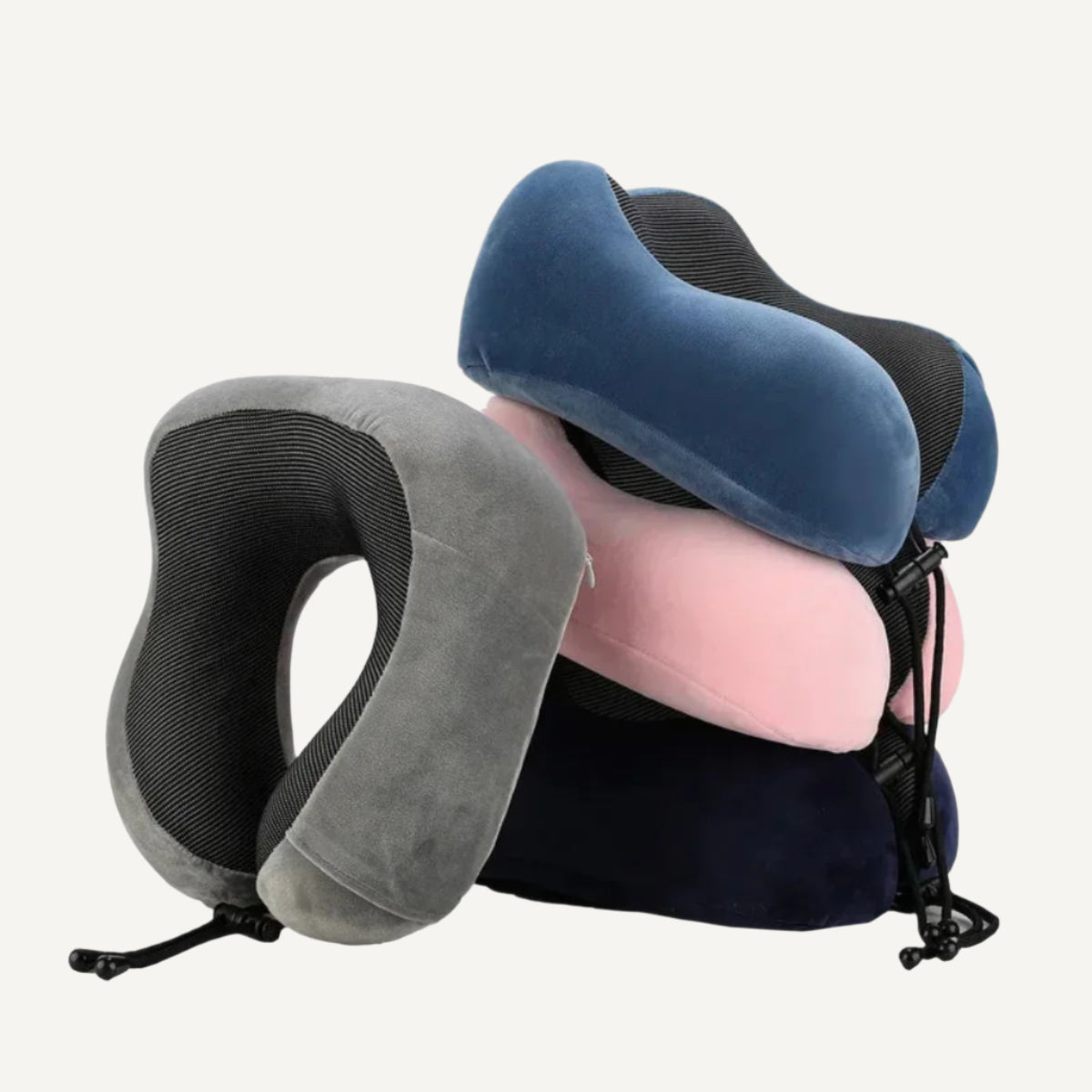 l'oreiller cervical en mousse à mémoire de forme Wanderer en blue, bleu marine, rose, et gris sont montré les uns sur les autres